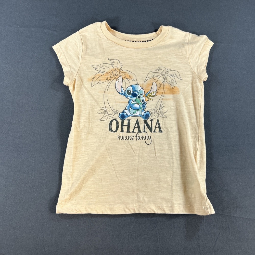cream-colored Disney graphic tee features an adorable Obana  of Stitch Large